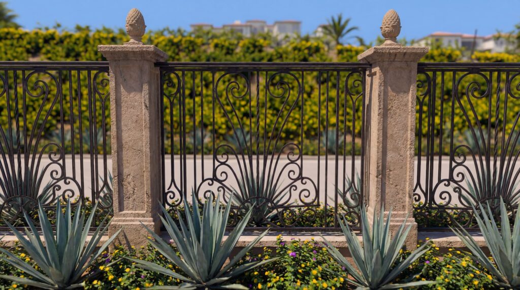 Custom modern black wrought iron fence for estate security and sloped property perimeter in Rancho Santa Fe.